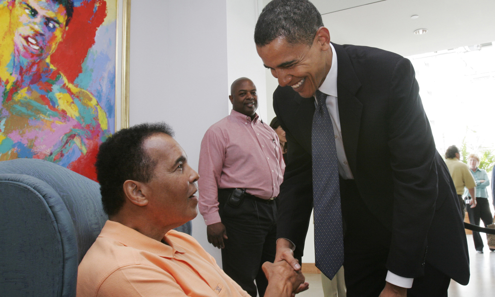 FILE from SEP. 14, 2006 SAM UPSHAW JR. PHOTO / The Courier-Journal Muhammad Ali greeted U.S. Sen. Barack Obama yesterday at the Muhammad Ali Center. Obama called Ali 