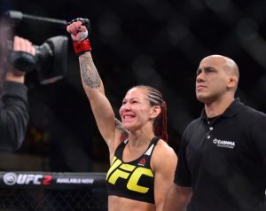 May 14, 2016; Curitiba, Brazil; Cris Justino (red) reacts after defending Leslie Smith (not pictured) during UFC Fight Night at Arena Atletico Paranaense. Mandatory Credit: Jason Silva-USA TODAY Sports